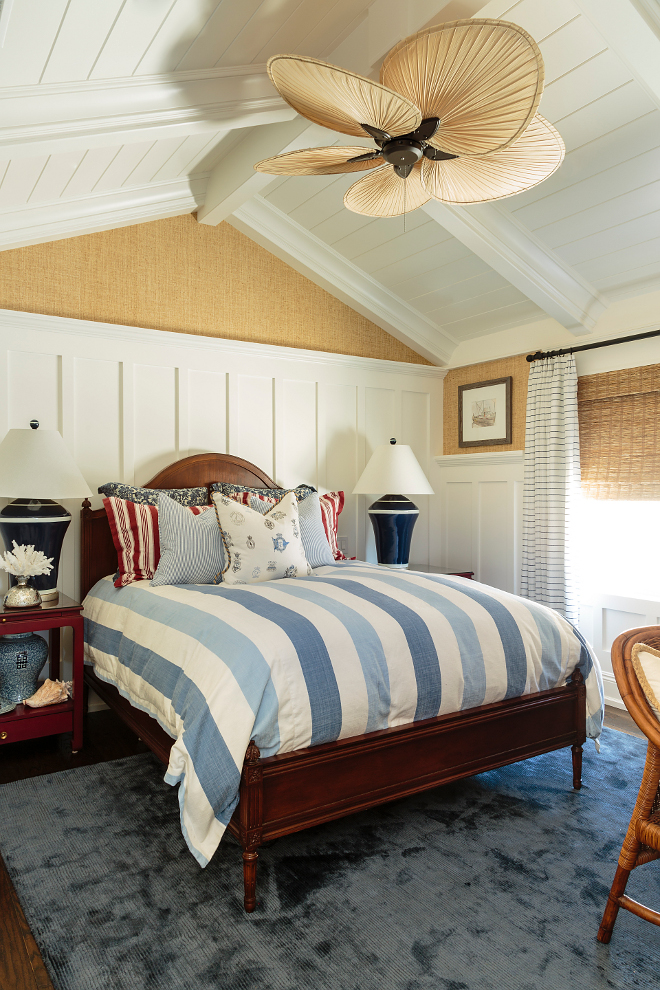 Coastal bedroom with board and batten and vaulted ceilings