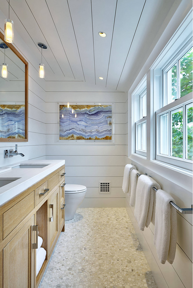 This bubble floor tile is perfect for this coastal bathroom and it works great with the White Oak vanity and shiplap walls