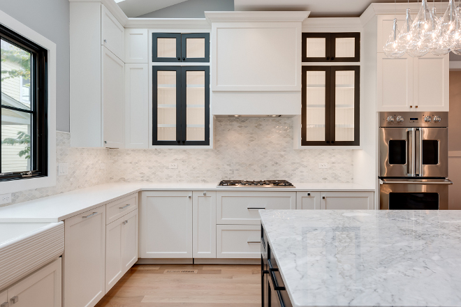 White kitchen with shaker-style cabinets and marble backsplash White kitchen with shaker-style cabinets and marble backsplash #Whitekitchen #shakerstylecabinets #marblebacksplash