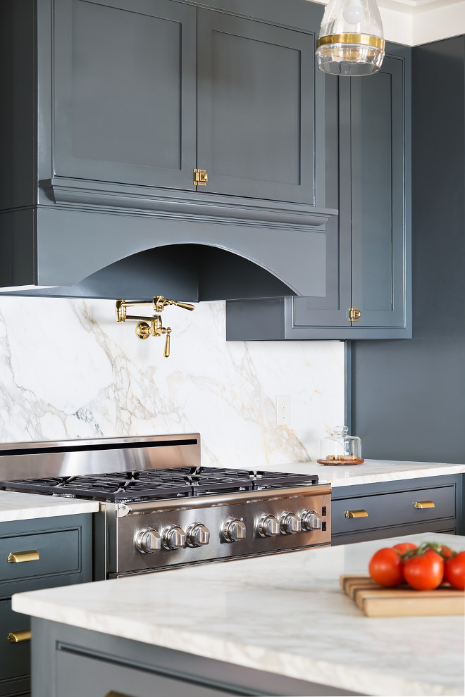 Kichen with brass hardware. Navy Grey Kitchen cabinets with brass cabinet Hardware is shared on HomeBunch