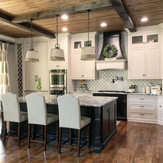 Rustic Farmhouse kitchen with white cabinets, black island and beamed V-Groove Pine Plank ceiling #FarmhouseKitchen