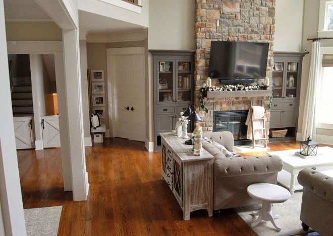 Foyer opens to great room with stone fireplace sources on Home Bunch