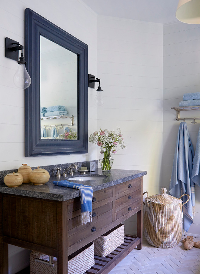 Farmhouse bathroom Farmhouse bathroom with reclaimed vanity with Riverrock Granite countertop, herringbone brick floor tile and shiplap #farmhousebathroom #brickflooring #herringbonebrick #shiplap